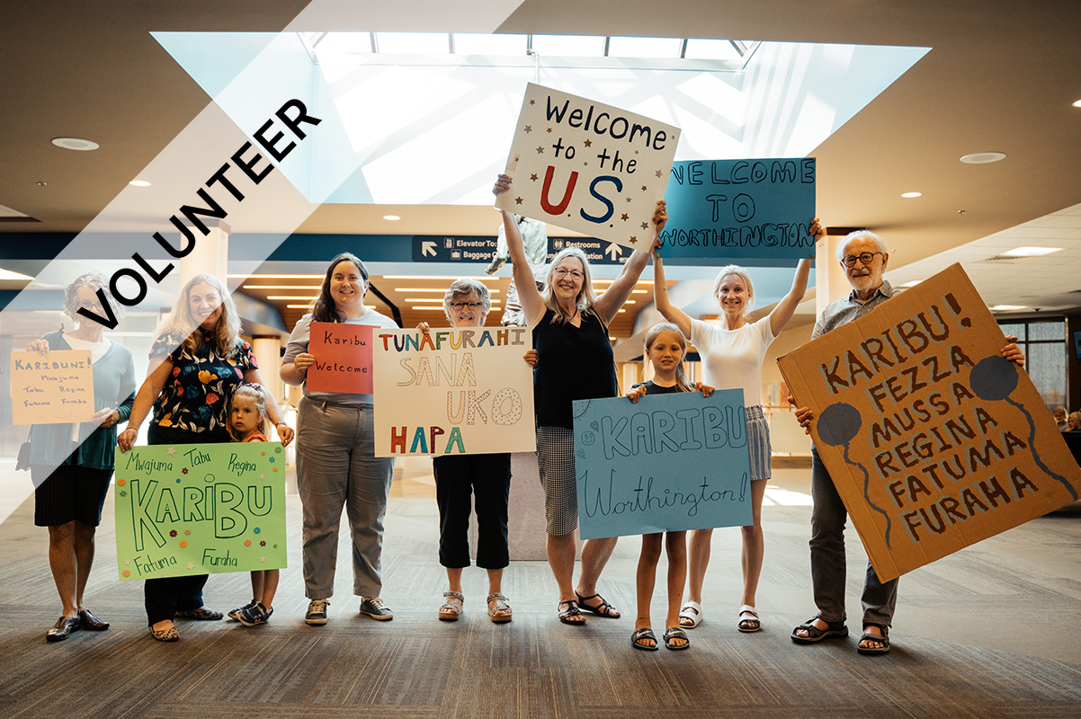 People welcoming refugees to airport
